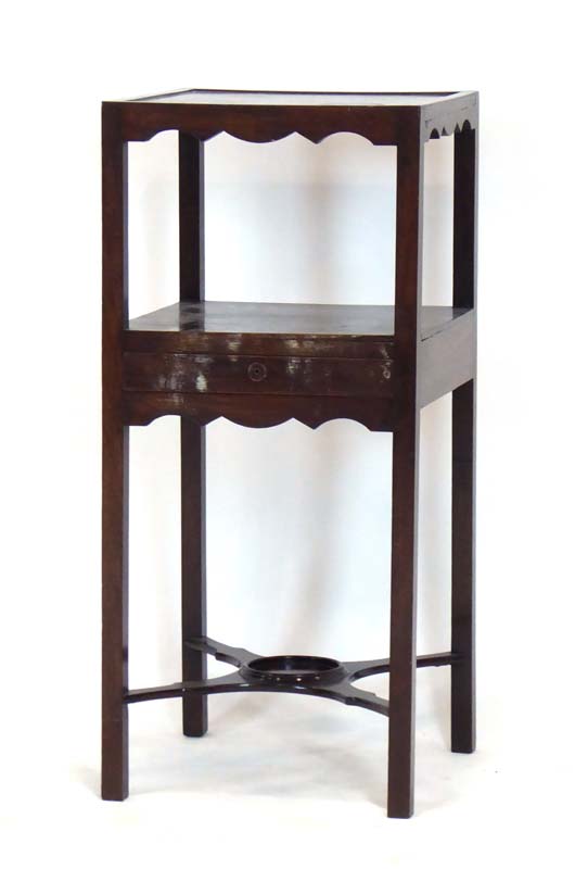 A Georgian mahogany three-tier pot stand with a single central drawer on square straight legs, w.