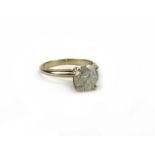A 14ct white gold ring set single brilliant cut diamond in a four claw setting,