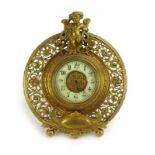 A 19th century French strutt timepiece, the enamelled face with Arabic numerals,