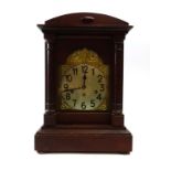 A 1930's German mantle clock, the Junghans movement striking on five chimes, within a mahogany case,