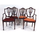 A matched set of eight mahogany and marquetry shield-back dining chairs,