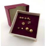 Four pairs of 9ct yellow gold and yellow metal ear studs,