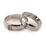 A pair of white metal wedding bands, each set three small diamonds, ring sizes Y and Q, overall 11.