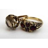Two 9ct yellow gold dress rings set smoky quartz and garnet, various sizes,