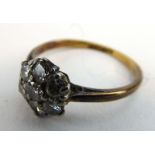 An early 20th century 18ct yellow gold cluster ring set seven small diamonds, ring size M, 2.