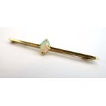 A 15ct yellow gold bar brooch set oval opal, w. 6 cm, 3.