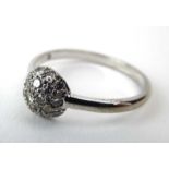 An 18ct white gold ring pave set small diamonds in a half spherical setting, ring size T, 3.