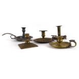 A group of five 19th century and later brass and pewter chambersticks