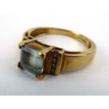 A 9ct yellow gold ring set square cut topaz and small diamonds, ring size L, 2.