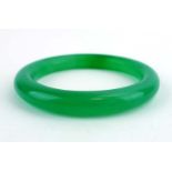 A green jade bangle, internal d. 5.