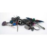 A mixed parcel of silver and metalware jewellery including enamelled brooches, stick pins,