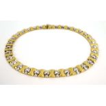 A Kria 18ct two colour gold articulated link necklace set nine brilliant cut diamonds in rubover