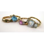 A group of four 9ct yellow gold dress rings set coloured stones and small diamonds, various sizes,