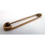 A 9ct rose gold safety pin, 2.