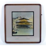 A Japanese metalware and parcel gilt plaque depicting a pagoda in shallow relief,