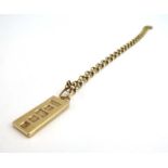A 9ct yellow gold chainlink necklace suspending a 9ct yellow gold ingot pendant, 16.