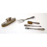 A four piece silver mounted manicure set including toothbrush and tweezers,