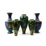 A pair of modern Chinese vases of baluster form, typically decorated with dragons on a blue ground,