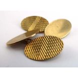 A pair of 9ct yellow gold cufflink's of oval form with engraved decoration,