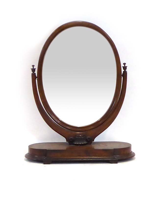 A Victorian walnut dressing table mirror, the oval plate on a platform base, h.