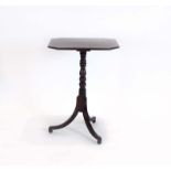 A Georgian mahogany and ebony strung occasional table on a turned column with three splayed feet, w.