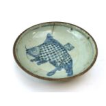 A Chinese blue and white cargo dish centrally decorated with a stylised fish, d. 17.