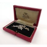 A 9ct white gold bar brooch set small pearls in the form of branch, w. 5 cm, 4.