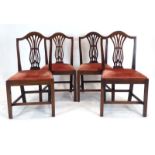 A set of four Georgian oak provincial dining chairs with drop-in seats