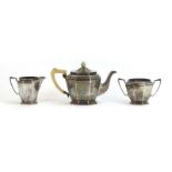 A silver three piece tea service of canted vase shaped form, Mappin & Webb, Sheffield 1934,