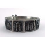 An early 20th century Portuguese silver bracelet repousse decorated with famous Portuguese