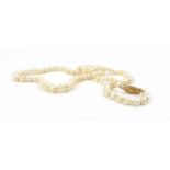 A single strand slightly graduated pearl necklace with 9ct yellow gold marquise shaped clasp,
