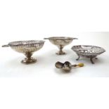 A pair of miniature silver two handled dishes with pierced borders, London 1925, w. 12.