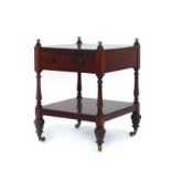 A William IV mahogany two-tier table with a single drawer, turned supports,