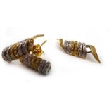 A pair of 18ct two colour ear studs of spiral form each set forty-one small brilliant cut diamonds,