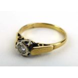 An 18ct yellow gold ring set single brilliant cut diamond in an illusion setting, ring size J, 1.