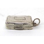 A Victorian silver and parcel gilt vinaigrette of cushioned rectangular form with pierced grille,