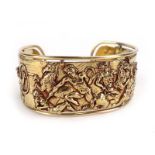 A 1970's Sante Privitera 18ct yellow gold cuff bracelet relief decorated in the Renaissance manner
