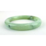 A pale green/white jade bangle, internal d. 5.