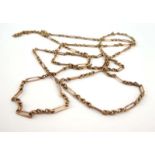 A 9ct yellow gold elongated fancy link muff chain, l. 148 cm, 34.