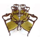 A set of eight mahogany dining chairs with shell pediments over drop-in seats on cabriole legs,