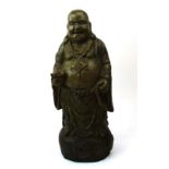 A Chinese carved and painted pine figure modelled as the standing Buddha, h. 45.