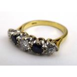 An 18ct yellow gold ring set three graduated diamonds interspersed with two sapphires,