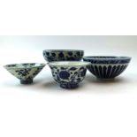A Chinese blue and white footed bowl decorated with foliate scrolls, four character mark to base, d.