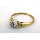 A 9ct yellow gold ring set diamond in an illusion setting,