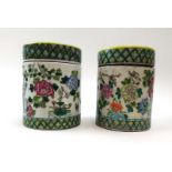A pair of Cantonese jars and covers of cylindrical form decorated with exotic birds amongst