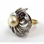 A 9ct white and yellow gold ring set cultured pearl and small rubies in a bouquet design setting,