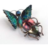 A late 19th/early 20th century yellow metal brooch set opal in the form of a butterfly, w. 4.