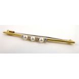 An 18ct yellow gold bar brooch set four small diamonds interspersed with three cultured pearls, w.