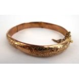 A 9ct yellow gold florally engraved bracelet, 8.