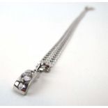 An 18ct white gold flat curblink necklace suspending a pendant set paste, overall 18.